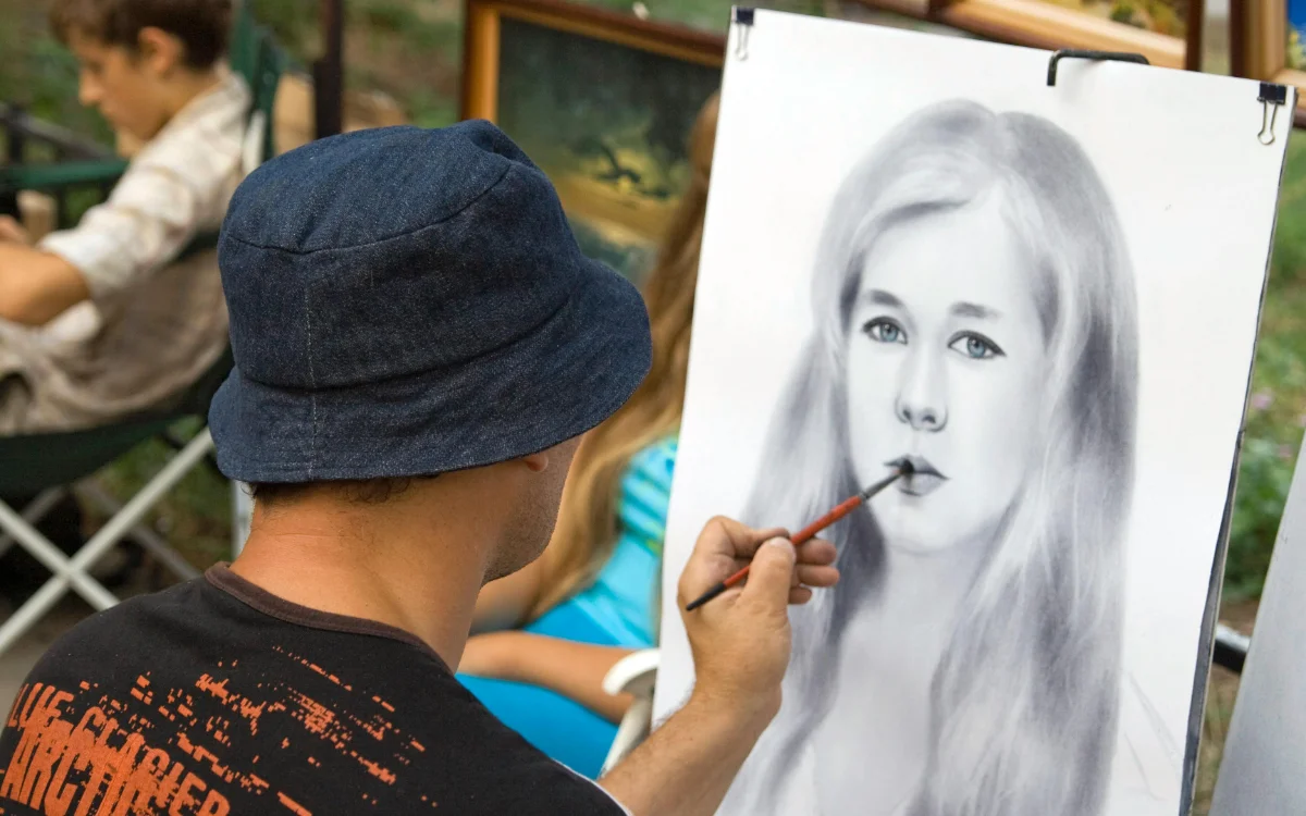 Artist Sketching Portrait in Outdoor Setting